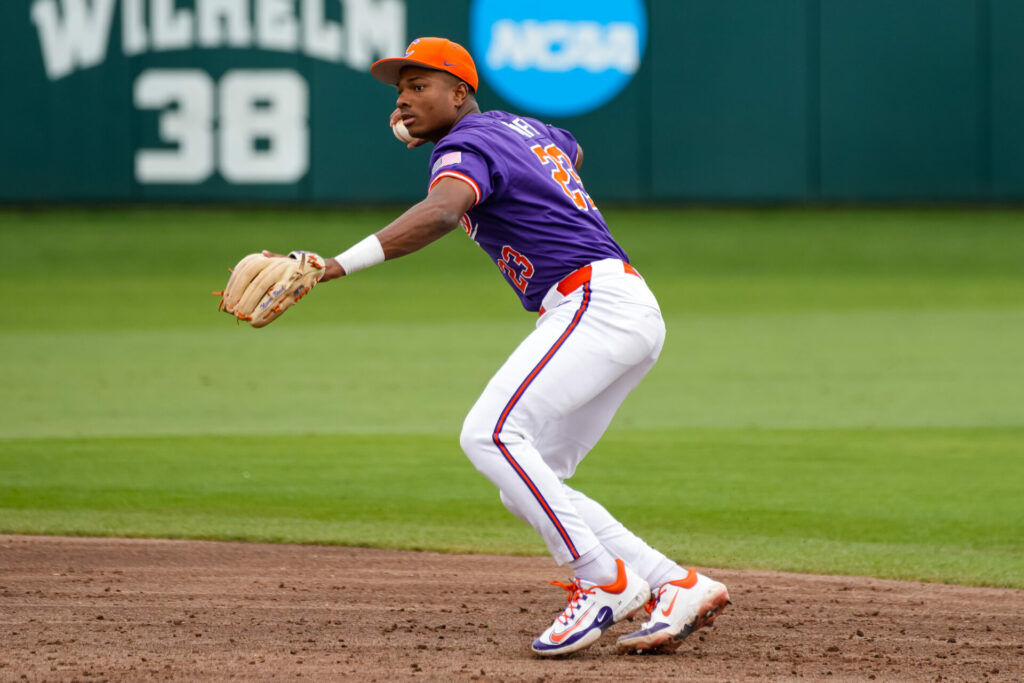 Jarren Purify throws out runner at first base.