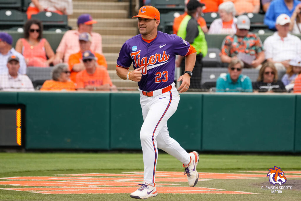 Coach Erick Bakich run from home plate