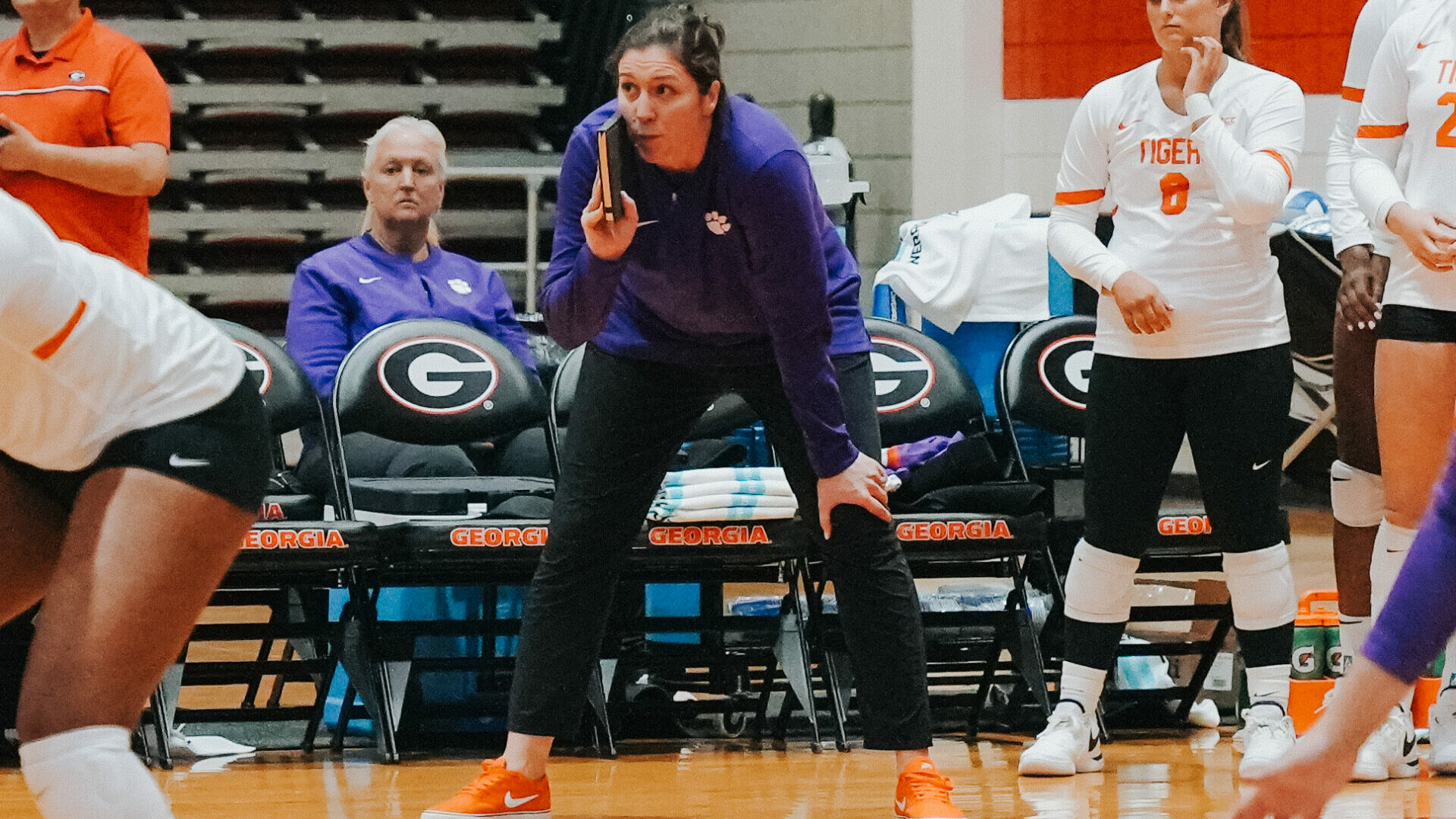Clemson volleyball coach shouting coaching orders to players