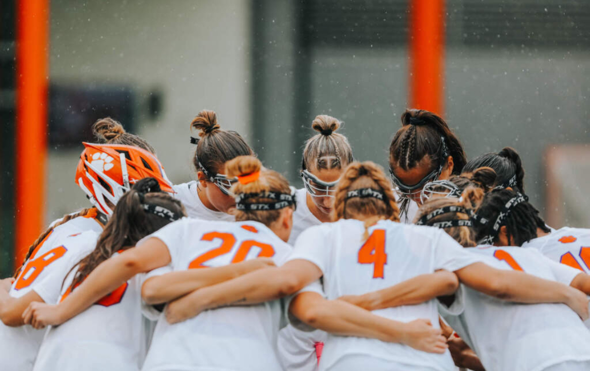 Clemson Lacrosse in a group huddle